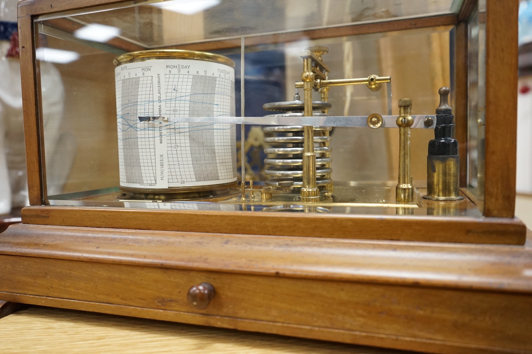 An early 20th century oak cased barograph by Finnigans Ltd., Manchester & Liverpool, with integral drawer underneath containing spare papers